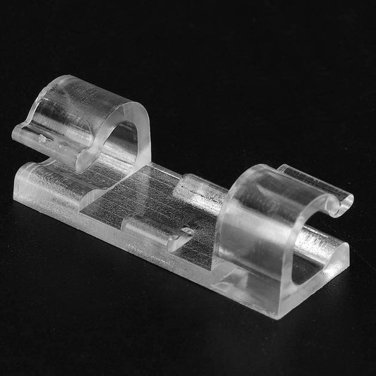 Clear plastic clip on a black background