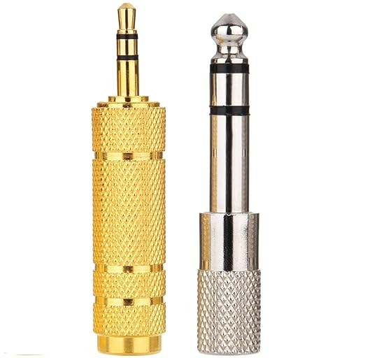 Two 3.5mm audio plug adapters shown side by side on a plain white background: one with a gold-plated finish and one with a silver-plated finish.