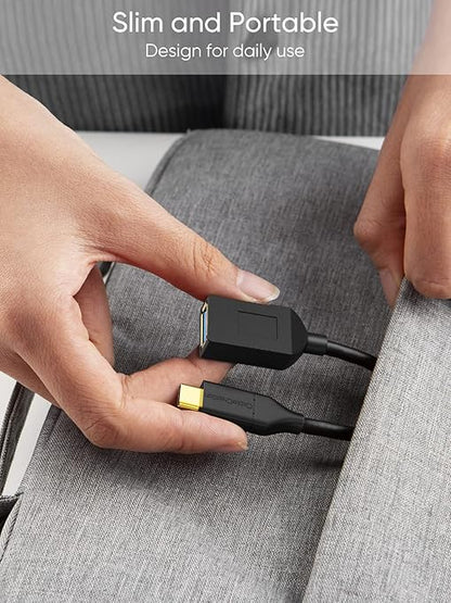USB-C to USB-A OTG Cable slim and portable design being placed into a backpack pocket for daily use