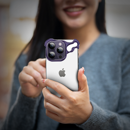 GRUNX Alien purple titanium ARC bumper iPhone 14 14 Pro Max case held by Indian woman showing bold purple rimless frame design