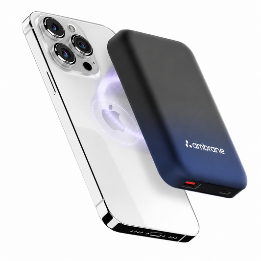 A portable power bank with a black-to-blue gradient finish and the brand name 'ambране' printed on the back, shown next to a smartphone on a clean white background.