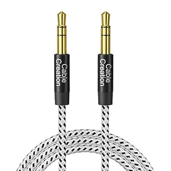 A braided audio cable with two gold-plated 3.5mm jack connectors and a black and white patterned cable, branded 'Cable Creation' on the black connector sleeves, shown on a white background.