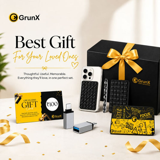 GrunX gift box for loved ones featuring ₹100 gift card, phone case, USB-C adapters, and accessory card in premium black and gold packaging