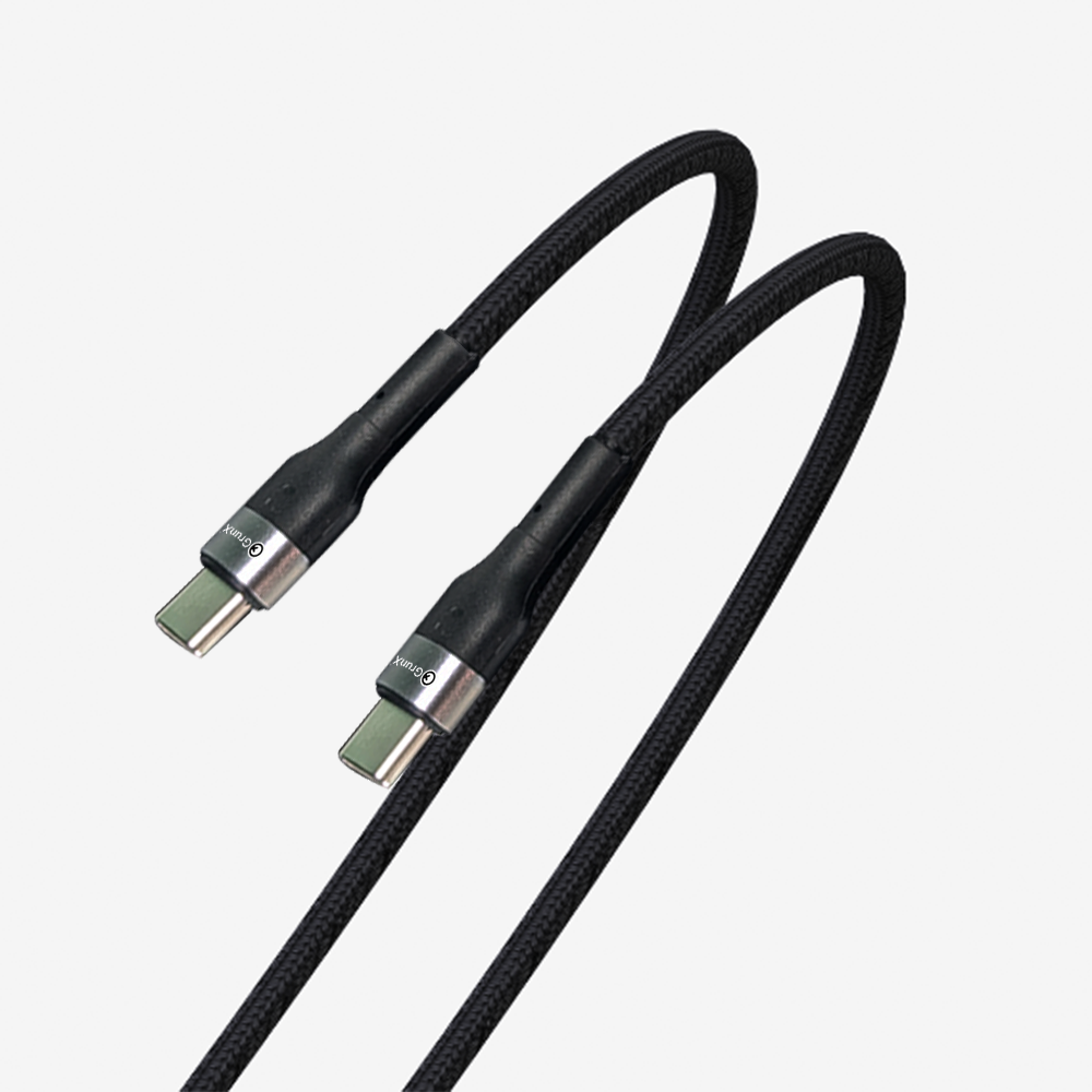 GRUNX Flash 100W cable connected to MacBook laptop showing full-speed charging in modern workspace India