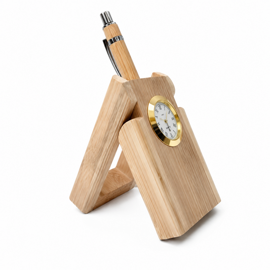 A bamboo desk organizer stand holding a matching bamboo pen, with an integrated round clock featuring a gold bezel and white face, photographed on a white background.