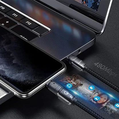 Laptop with a USB-C cable connected to a smartphone, displaying app icons on a screen.