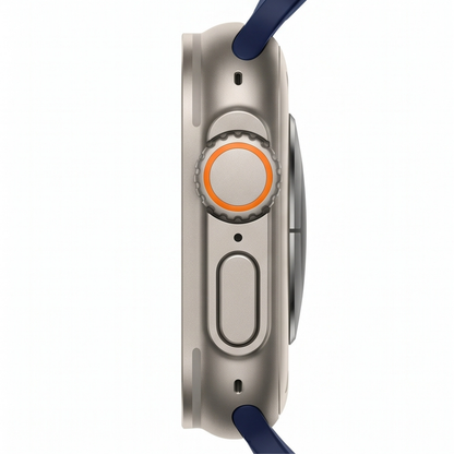 Rear view of an Apple Watch Ultra with titanium case and navy blue sport band, showing the advanced sensor array and band attachment lugs