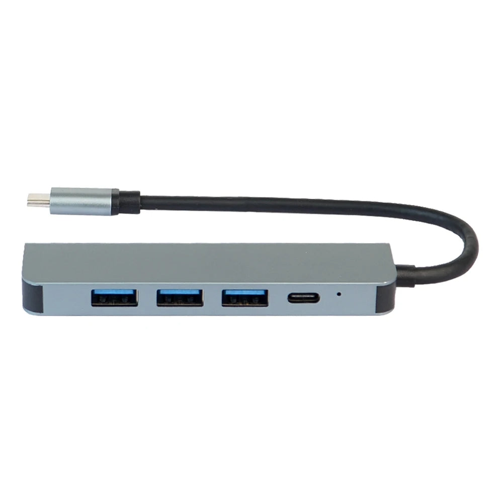GRUNX Military Grade 7-in-1 shockproof metal USB-C hub adapter 100W with all ports labeled on clean desk with MacBook