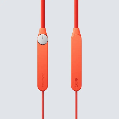 Orange earphones with a gray background