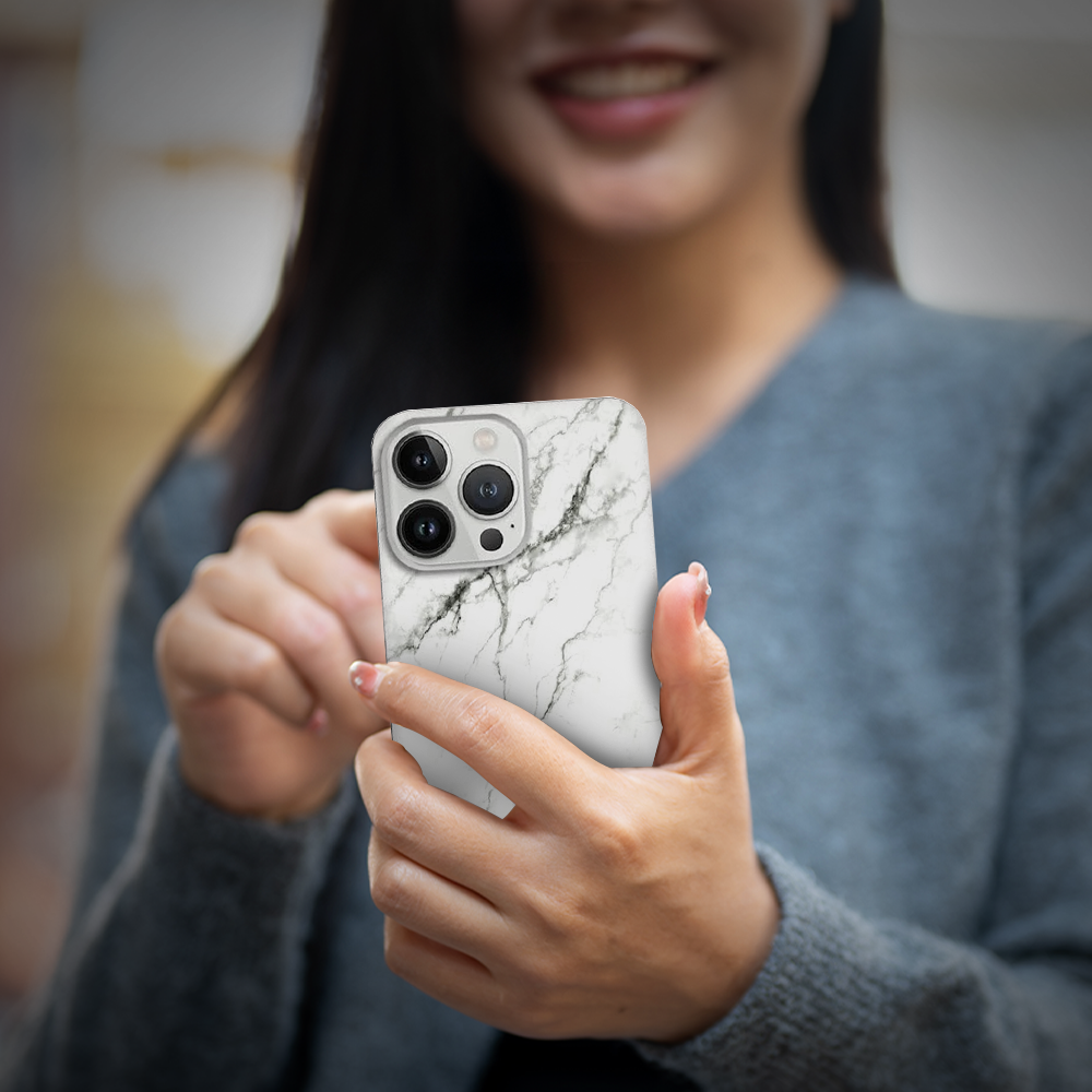 Woman holding GRUNX Pearl full body rugged hard iPhone 15 Plus white case India lifestyle urban