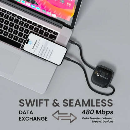Laptop with a smartphone connected to a Nordlink device on a gray background
