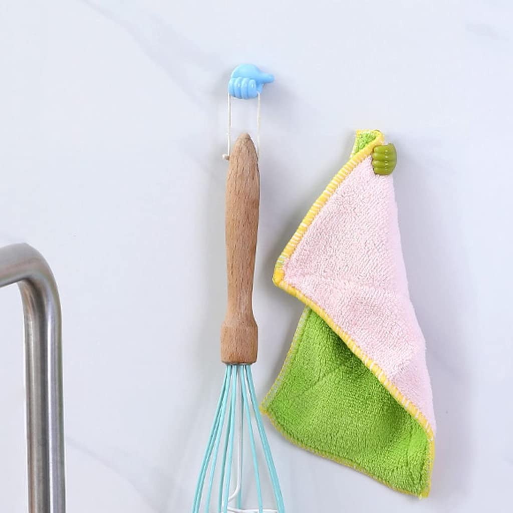 Multicolored towel with wooden handle and whisk hanging on a hook against a white background