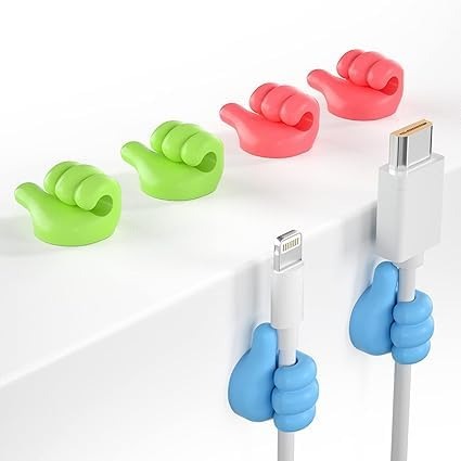 Colorful cable clips holding smartphone cables on a white background