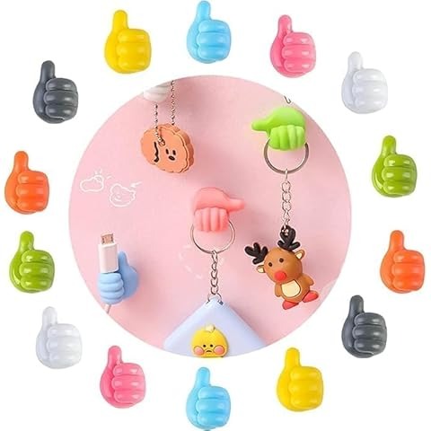 Colorful keychains shaped like thumbs and a reindeer on a white background