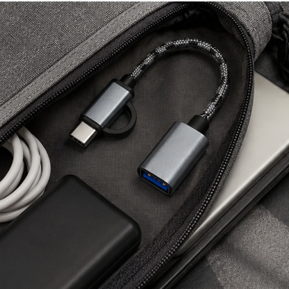 USB-C and Micro USB OTG adapter placed inside an open laptop bag | GrunX
