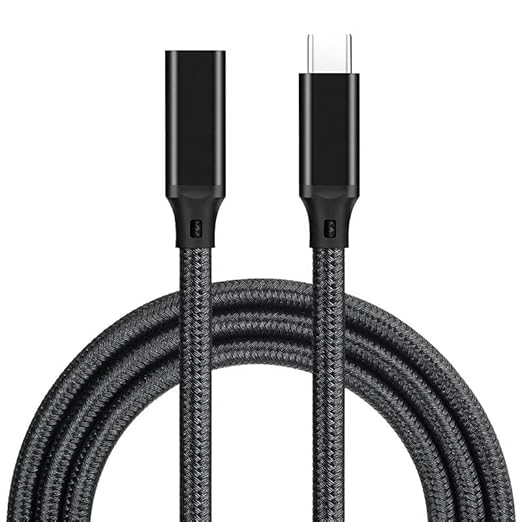 A black braided USB-C to USB-C charging cable coiled on a white background, showing the detailed texture of the woven outer layer and the metallic connector tips.