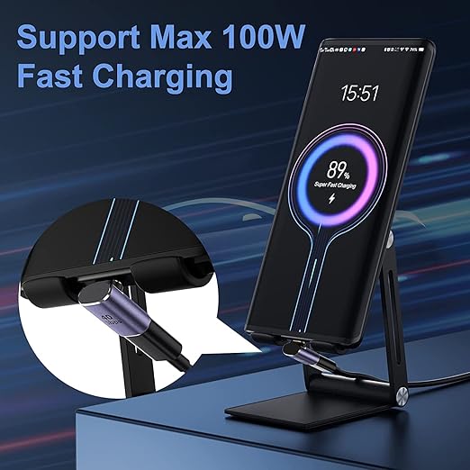 A black magnetic wireless phone charger stand holding a smartphone, with a circular inset showing the car adapter attachment. The image includes the text 'Support Max 100W Fast Charging' on a dark blue graphic background with diagonal light streaks.