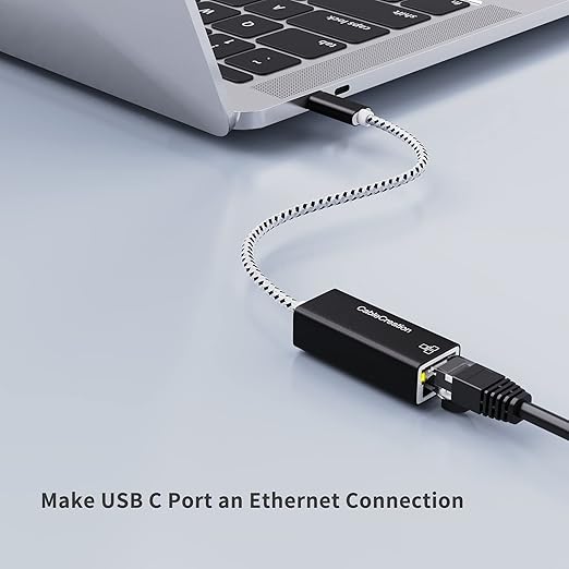 USB C to Ethernet adapter with braided cable plugged into MacBook USB C port for wired LAN connection
