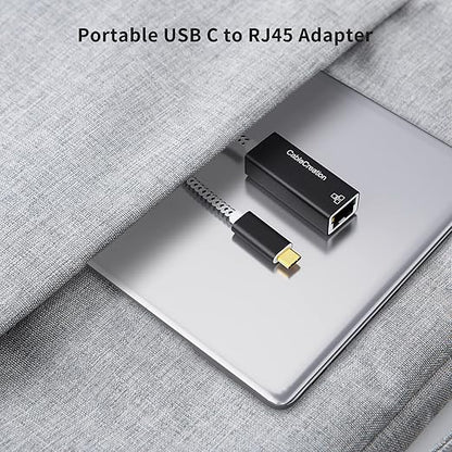 portable USB C to RJ45 Ethernet adapter connected to laptop inside travel bag