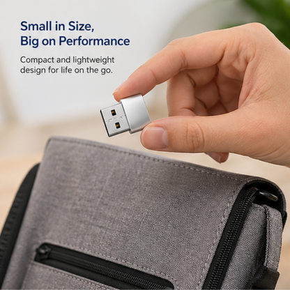 Compact USB-C to USB 3.0 OTG Adapter held in hand over travel bag showing portable lightweight design