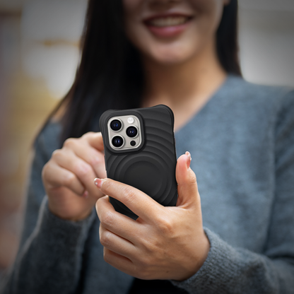 Close-up of GRUNX Wave raised 3D wave pattern texture liquid silicone iPhone case black grip
