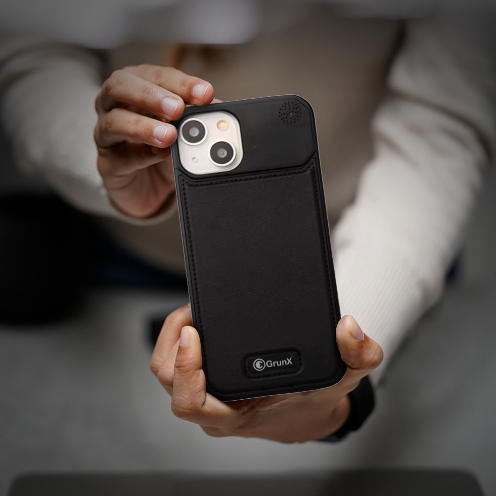 GRUNX aluminium leather iPhone case black showing slim profile and leather texture finish in hand Indian office