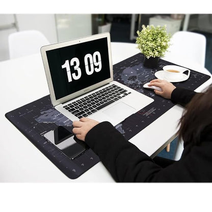 Woman using XXL world map extended desk mouse pad with laptop and mouse in modern office workspace
